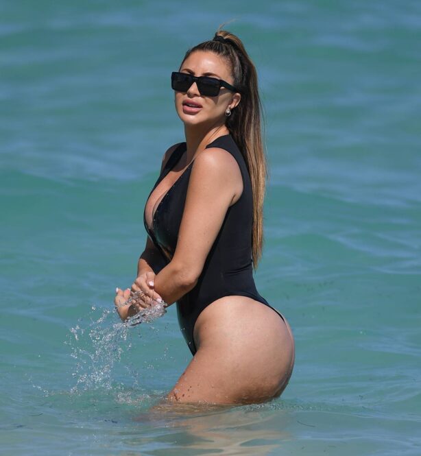 Larsa Pippen - In a black swimsuit on the beach in Miami