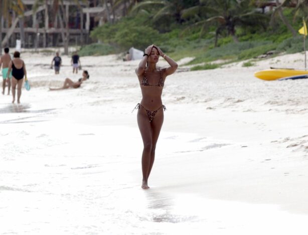 Laura Harrier - In a tiny leopard print bikini on the beach in Mexico