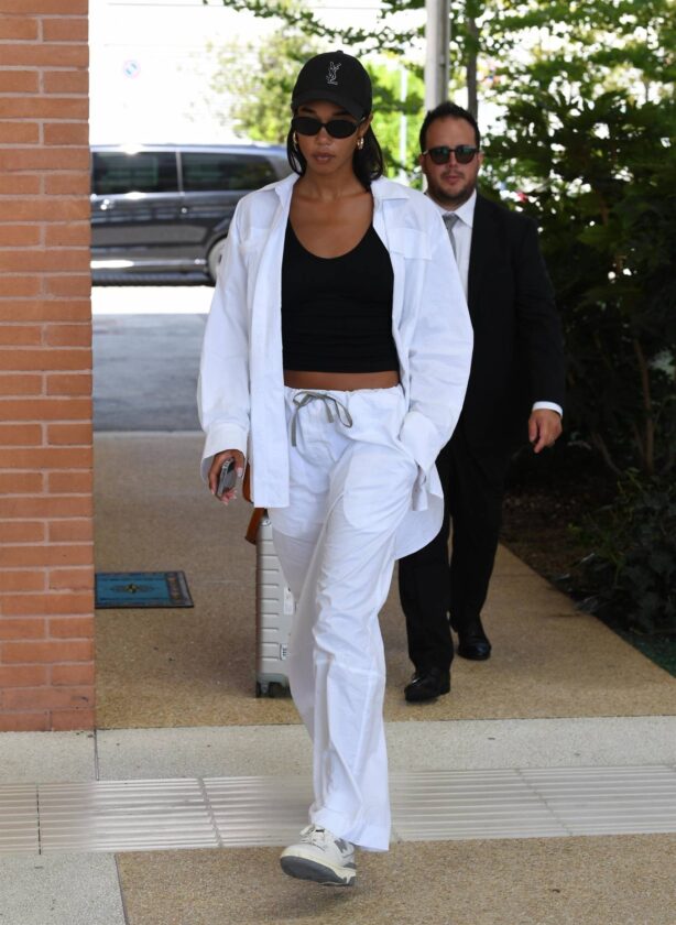 Laura Harrier - In a white tracksuit arriving at Venice Film Festival