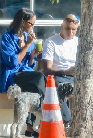 Laura Harrier - With Sam Jarou seen while walking their dog in Los Angeles