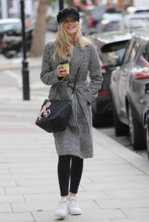 Laura Whitmore -In a peak cap and coat ahead of her BBC radio show in London