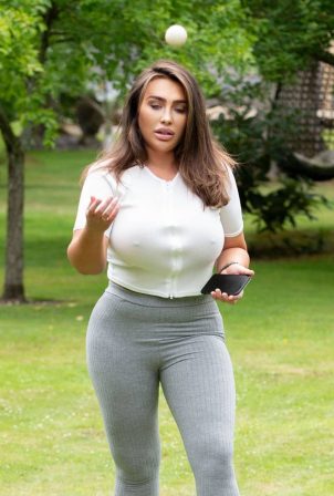 Lauren Goodger - Pictured while playing with a Dachshund in a park in Essex