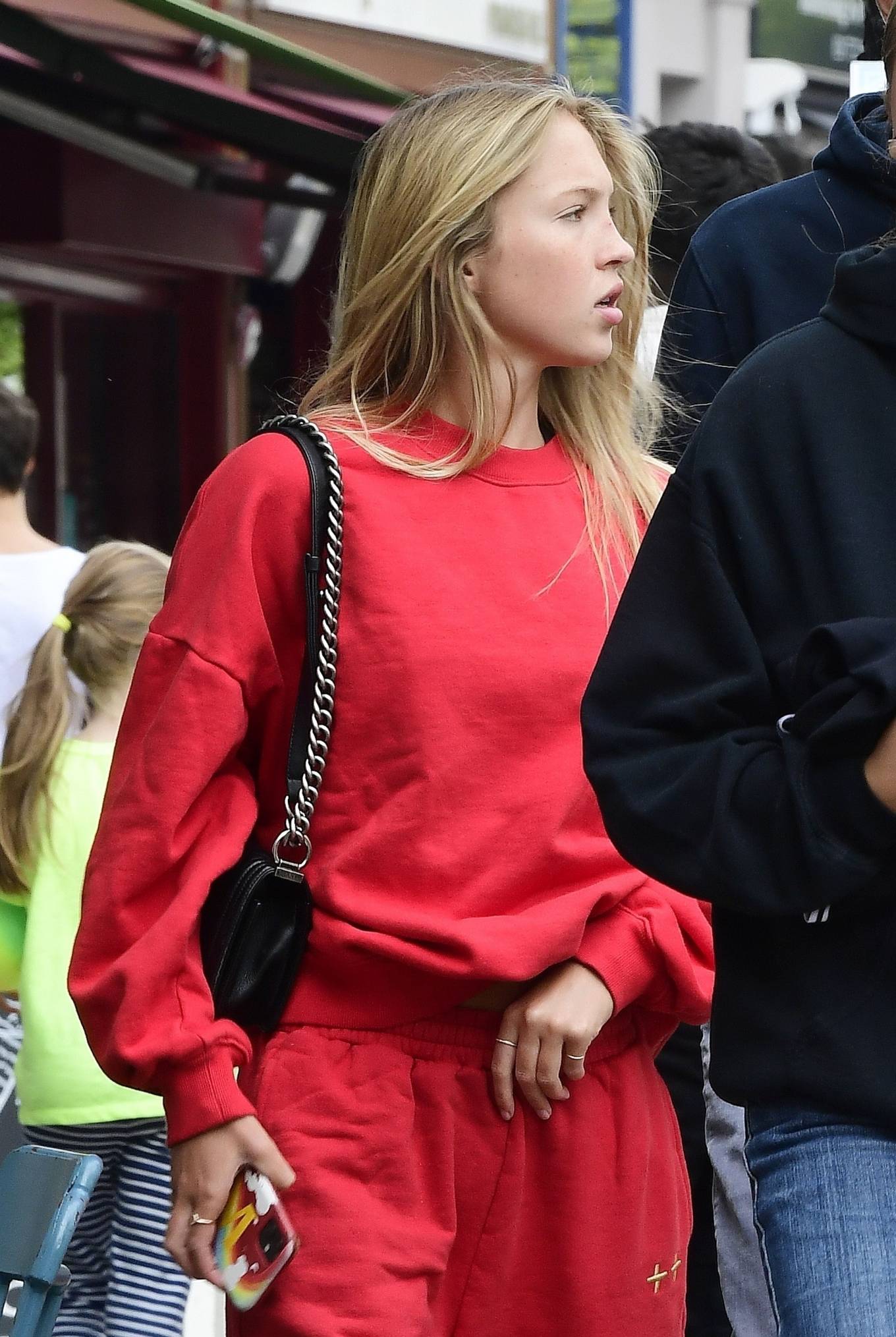 Lila Grace Moss - Wears a bright red tracksuit while out with friends in London