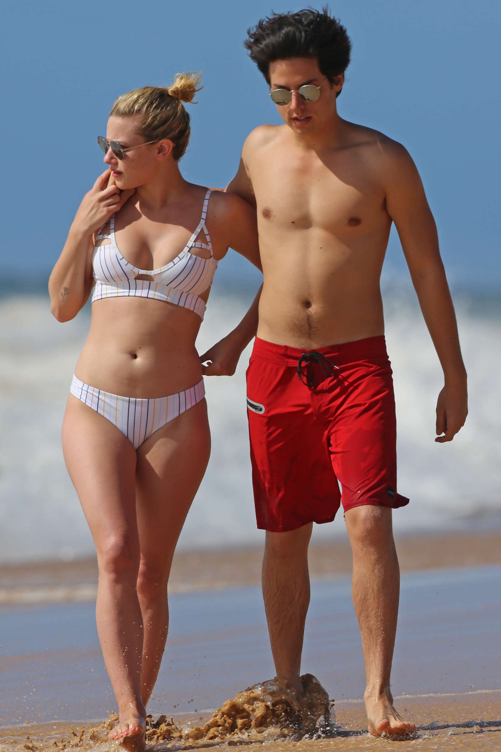 Lili Reinhart in Bikini with Cole Sprouse on the beach in Hawaii. 