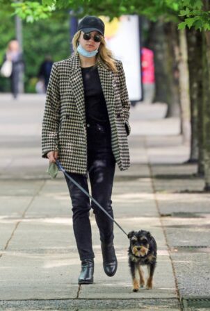 Lili Reinhart - Takes her rescue dog for a walk in Vancouver