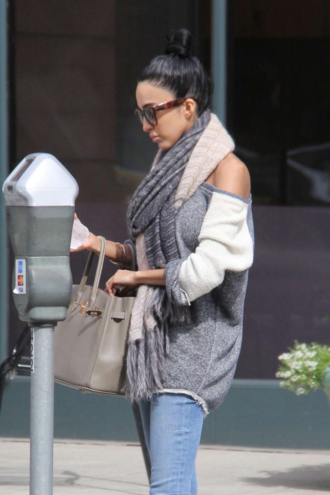 Lilly Ghalichi feed her parking meter in Beverly Hills