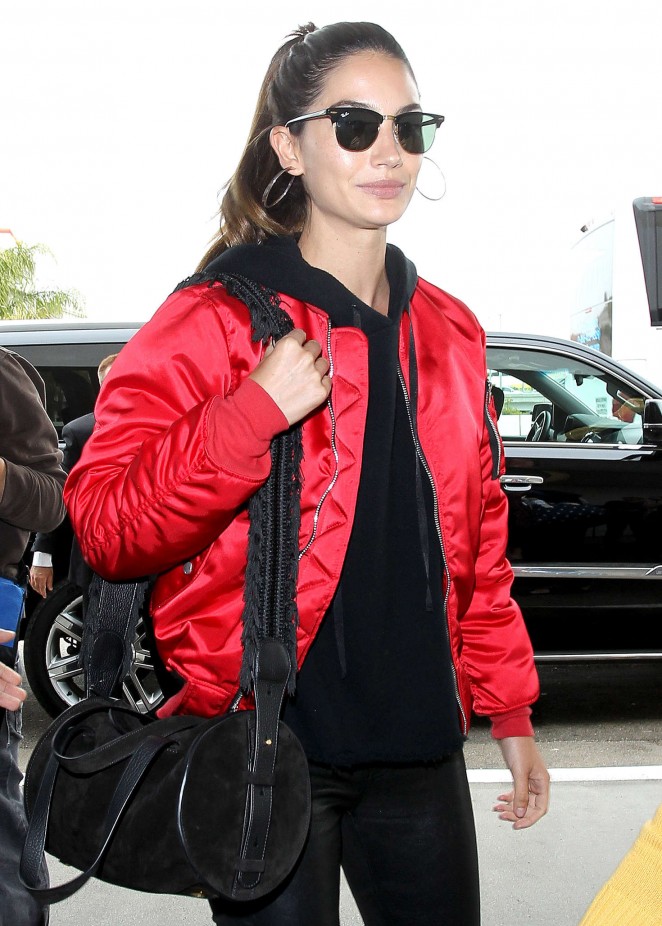 Lily Aldridge in red satin jacket at LAX Airport in Los Angeles
