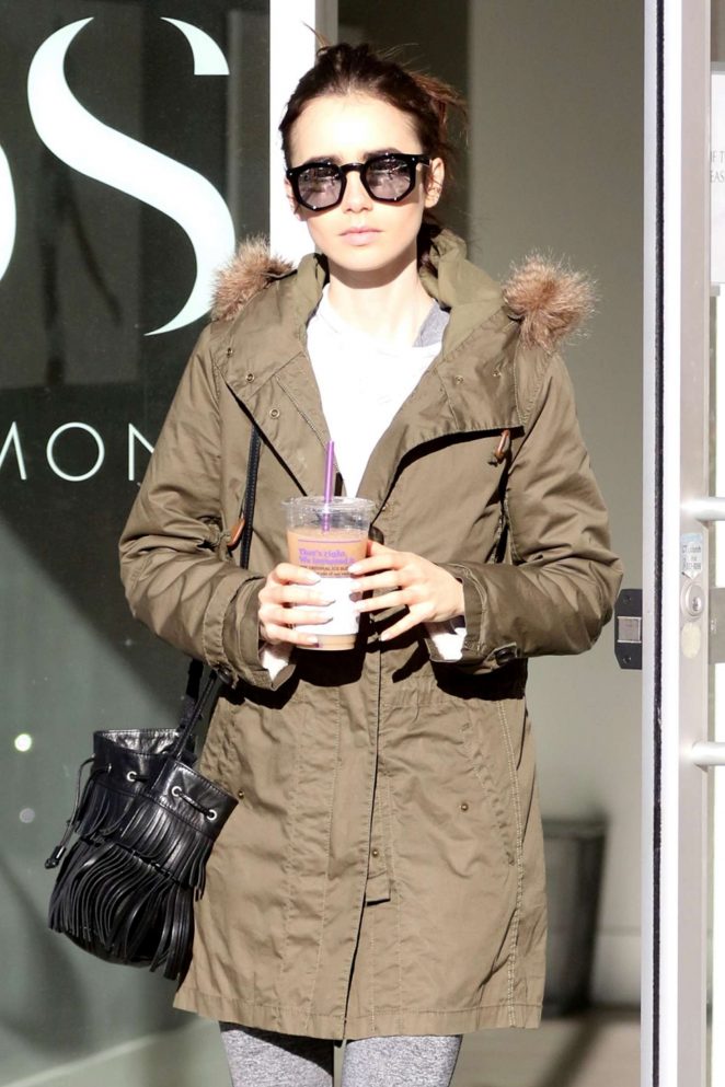 Lily Collin - Wearing a thick coat after leaving the gym in LA