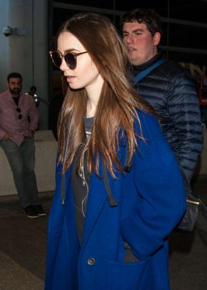 Lily Collins - Arrives at LAX International Airport in LA