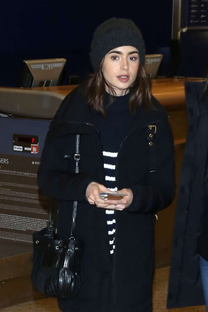 Lily Collins - Arriving at Salt Lake City Airport