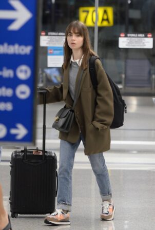 Lily Collins - Arriving in Los Angeles
