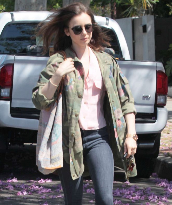 Lily Collins in a floral-print camouflage jacket in West Hollywood
