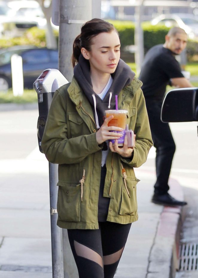 Lily Collins in Tights grab an iced tea in Beverly Hills