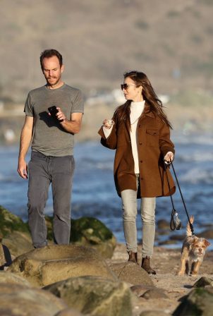 Lily Collins - Out for a walk on the beach in Carpinteria