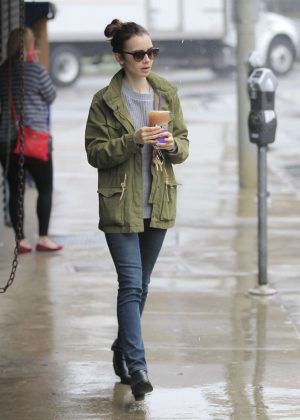 Lily Collins out in the rain in Beverly Hills
