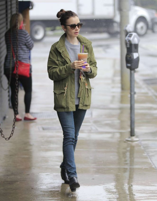 Lily Collins out in the rain in Beverly Hills
