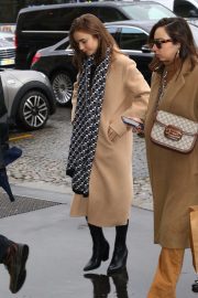 Lily Collins - Wears long coat while out in Paris