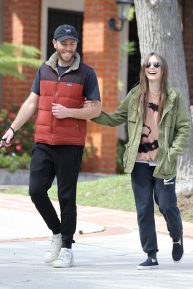 Lily Collins with her boyfriend takes her dog out for a walk in Los Angeles
