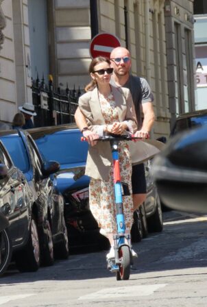 Lily Collins - With hubby Charlie McDowell seen using an electric sharing scooter in Paris