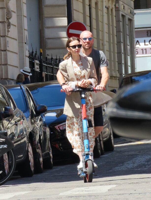 Lily Collins - With hubby Charlie McDowell seen using an electric sharing scooter in Paris