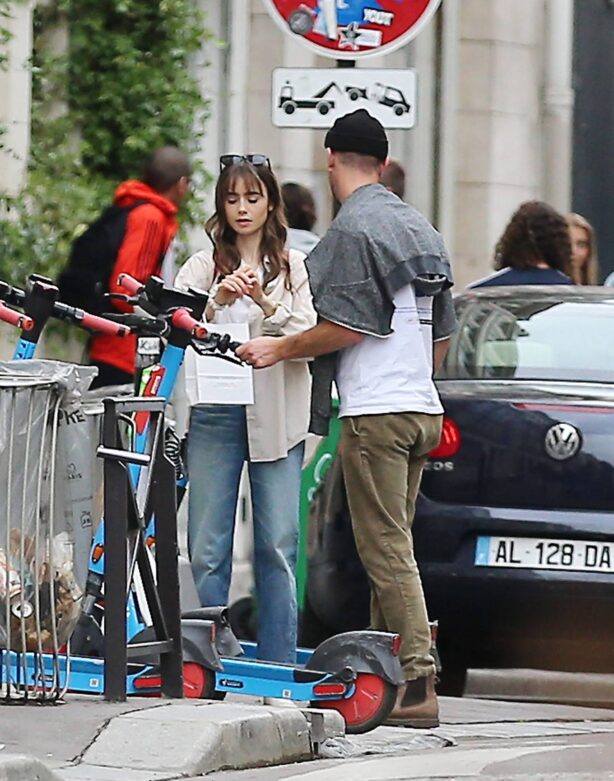 Lily Collins - With new boyfriend Charlie McDowell go for a ride in scooter in Paris