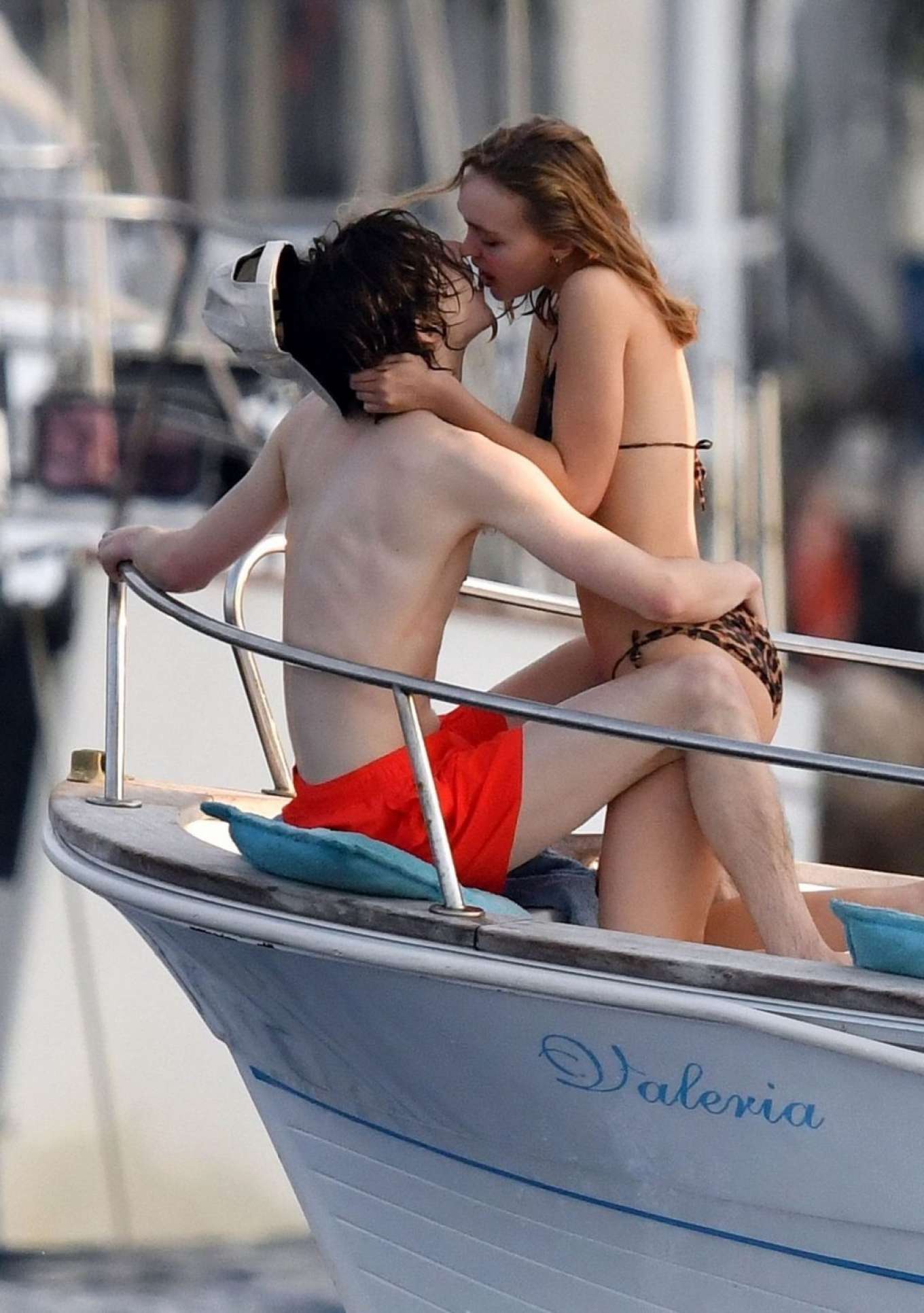 Lily Rose Depp in Animal Print Bikini on a boat in Italy. 