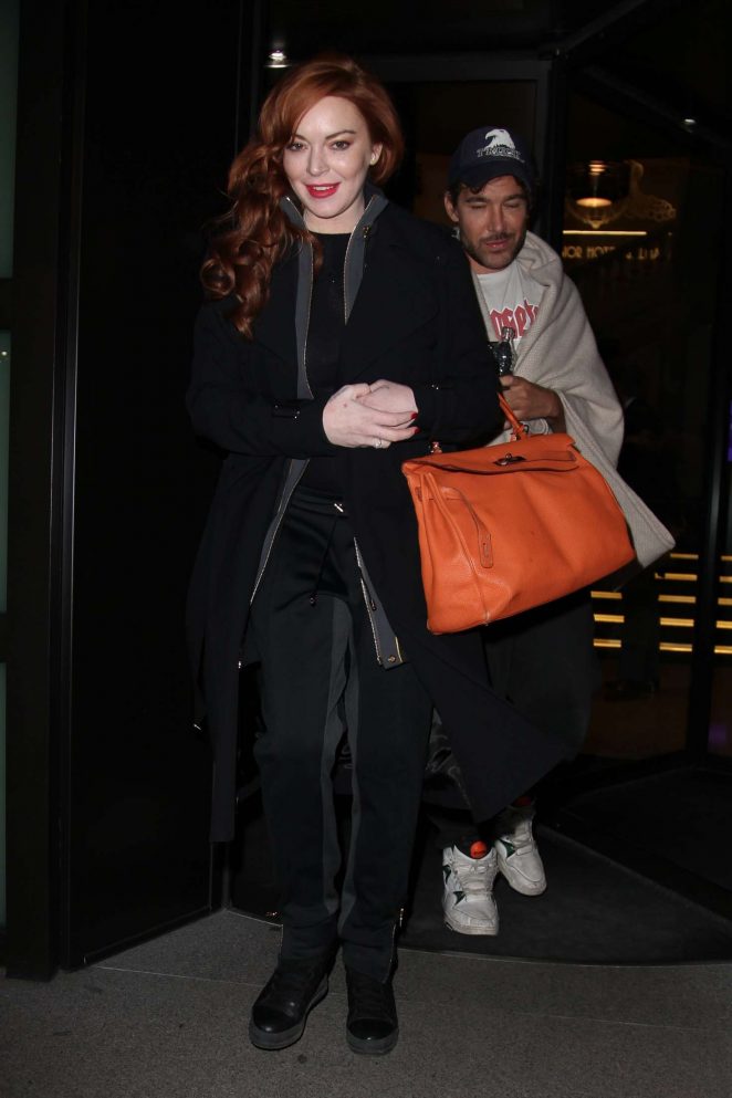 Lindsay Lohan in Black Coat Leaves her hotel in Milan