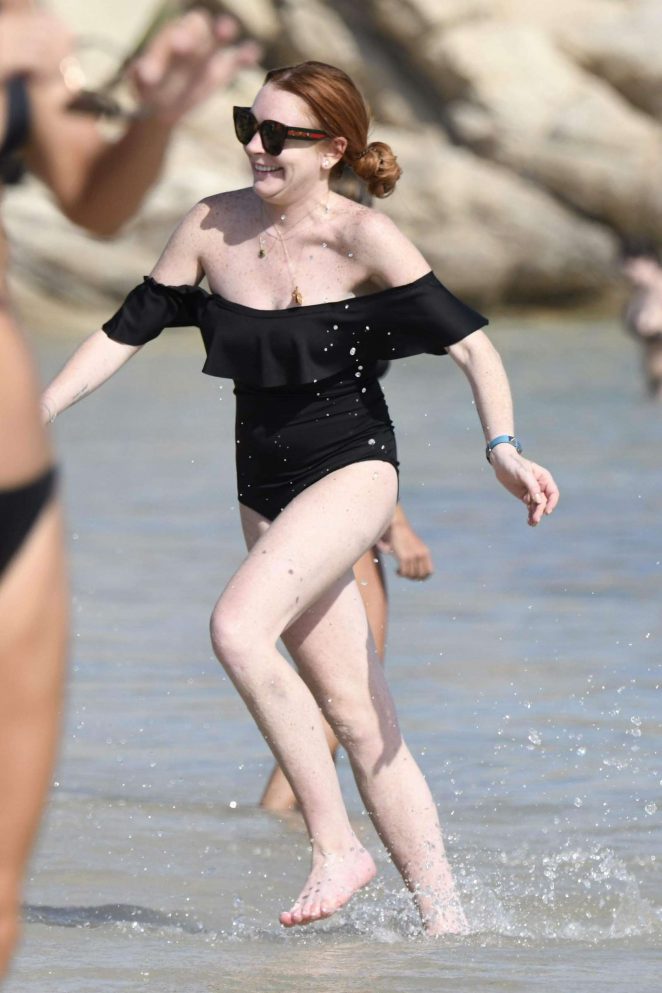 Lindsay Lohan in Black Swimsuit on the beach in Mykonos