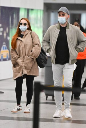 Lindsay Lohan - With husband Bader Shammas catch a flight out of New York