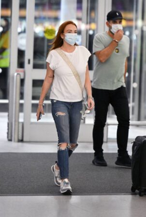 Lindsay Lohan - With husband Bader Shammas seen at JFK Airport in New York