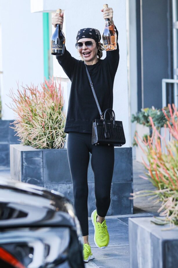 Lisa Rinna - Holding two bottles of her own wine in West Hollywood