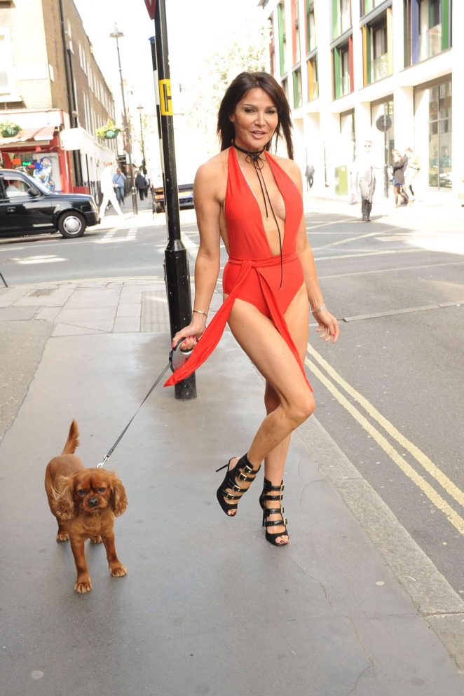 Lizzie Cundy in Red with her dog out in London