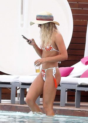 Louisa Johnson - Bikini by the pool with a friend in Ibiza