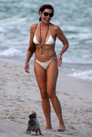 Luann de Lesseps - I a white bikini on the beach in Miami