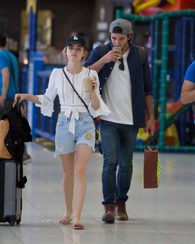 Lucy Hale in Jeans Shorts at Airport in Adelaide