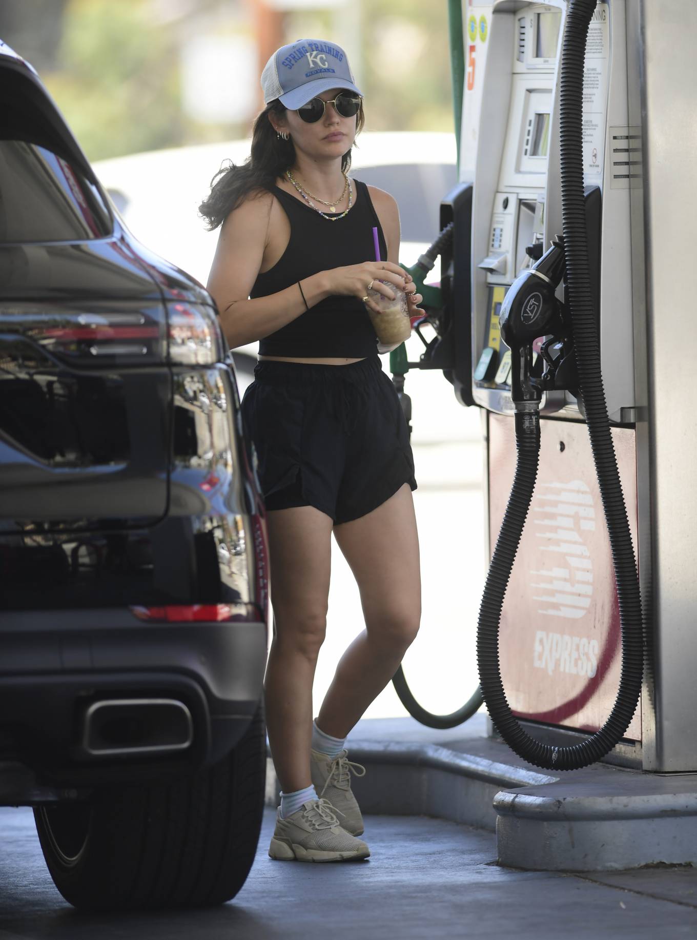 Lucy Hale 2022 : Lucy Hale – In shorts pumping gas in Los Angeles-14