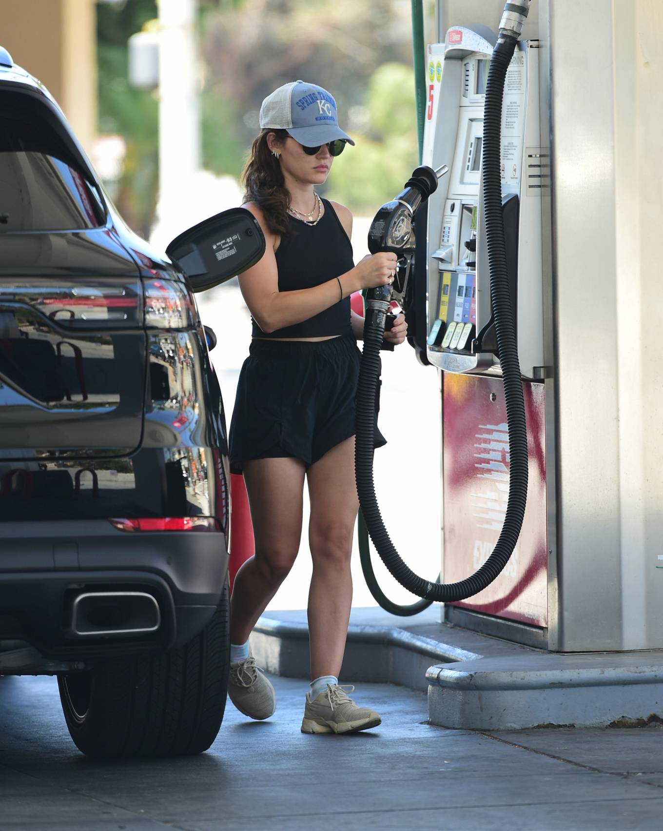 Lucy Hale 2022 : Lucy Hale – In shorts pumping gas in Los Angeles-15