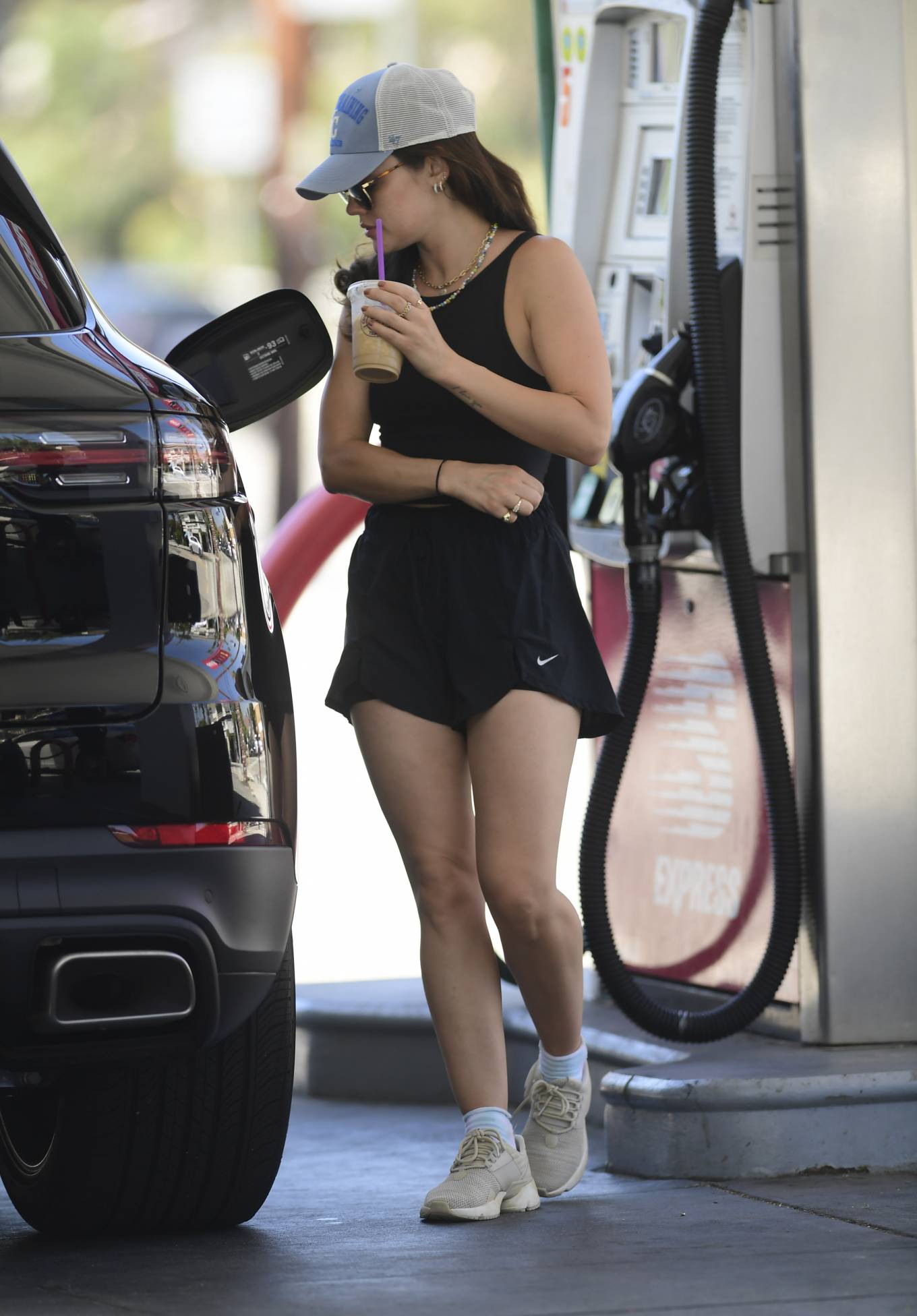 Lucy Hale 2022 : Lucy Hale – In shorts pumping gas in Los Angeles-17