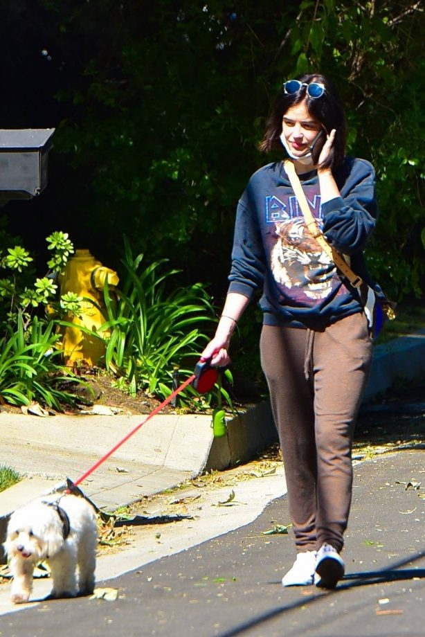 Lucy Hale - Out for a walk with her dog Elvis in Los Angeles