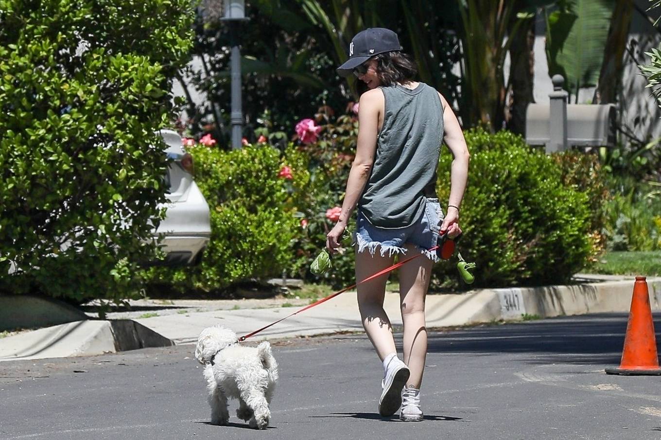 Lucy Hale â€“ Wearing denim shorts while dog walk in Beverly Hills