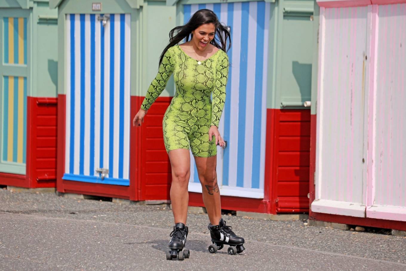 Lydia Clyma - Rollerblading in a green snakeskin outfit in Portsmouth. 