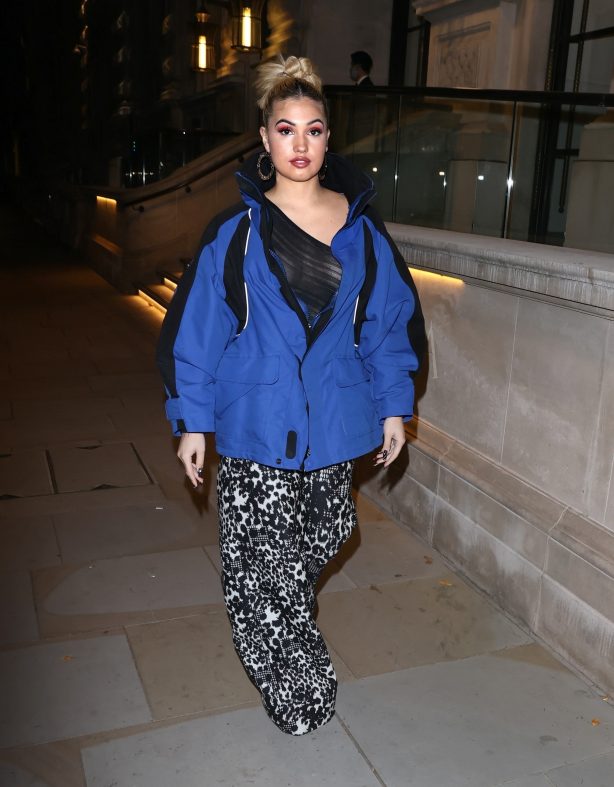 Mabel - In flared trousers while out in Soho