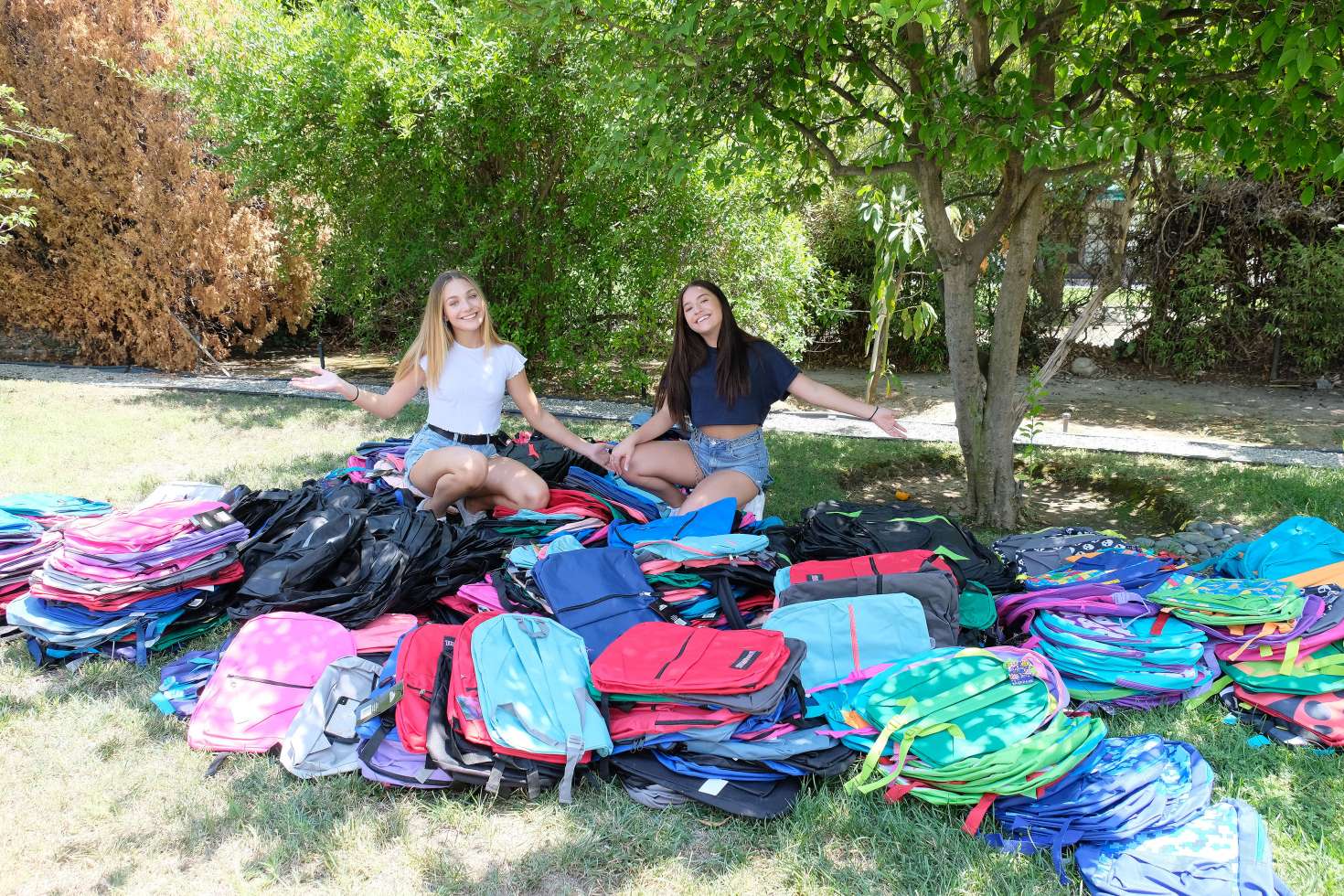 Maddie and Mackenzie Ziegler - Pack 750 backpacks to donate to foster kids and homeless teens in LA