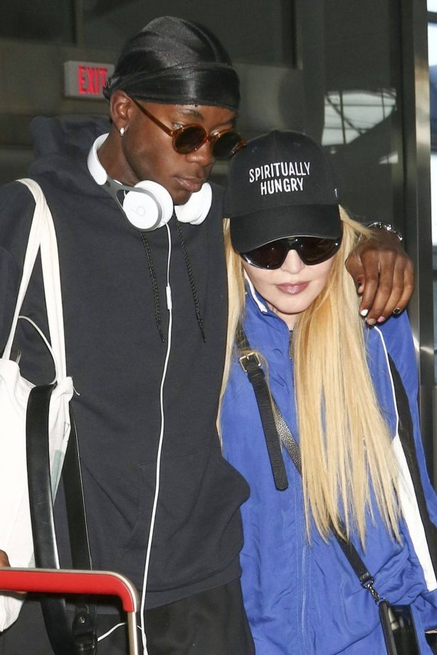 Madonna - And her son David spotted at JFK Airport in New York
