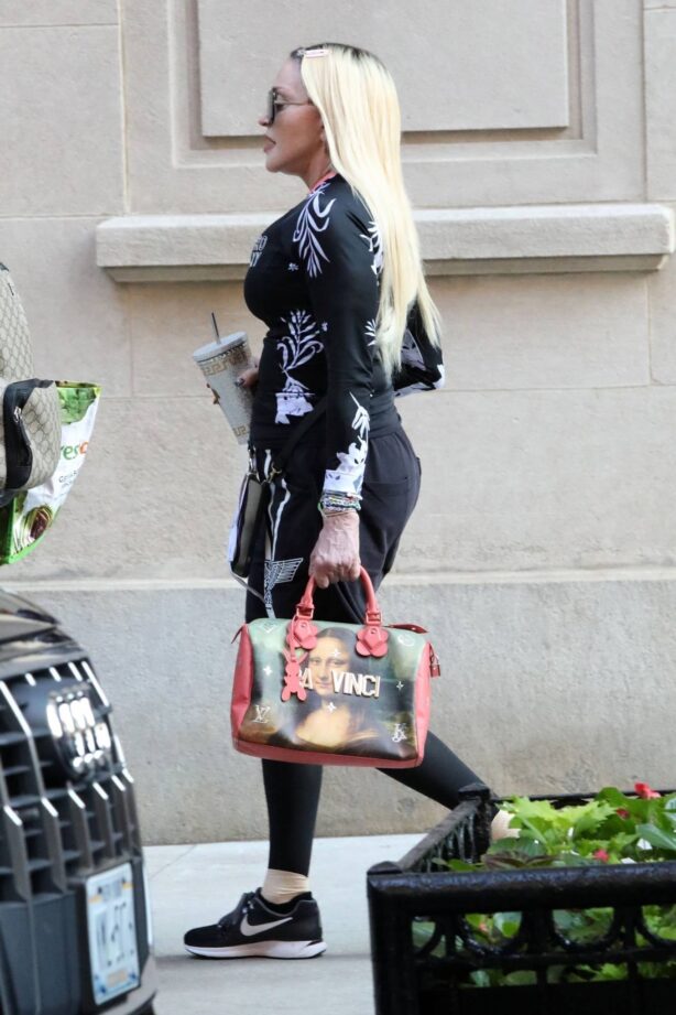 Madonna - Out with Louis Vuitton limited edition Jeff Koons Da Vinci purse in New York