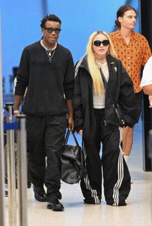 Madonna - Seen with her son David Banda at JFK Airport in New York