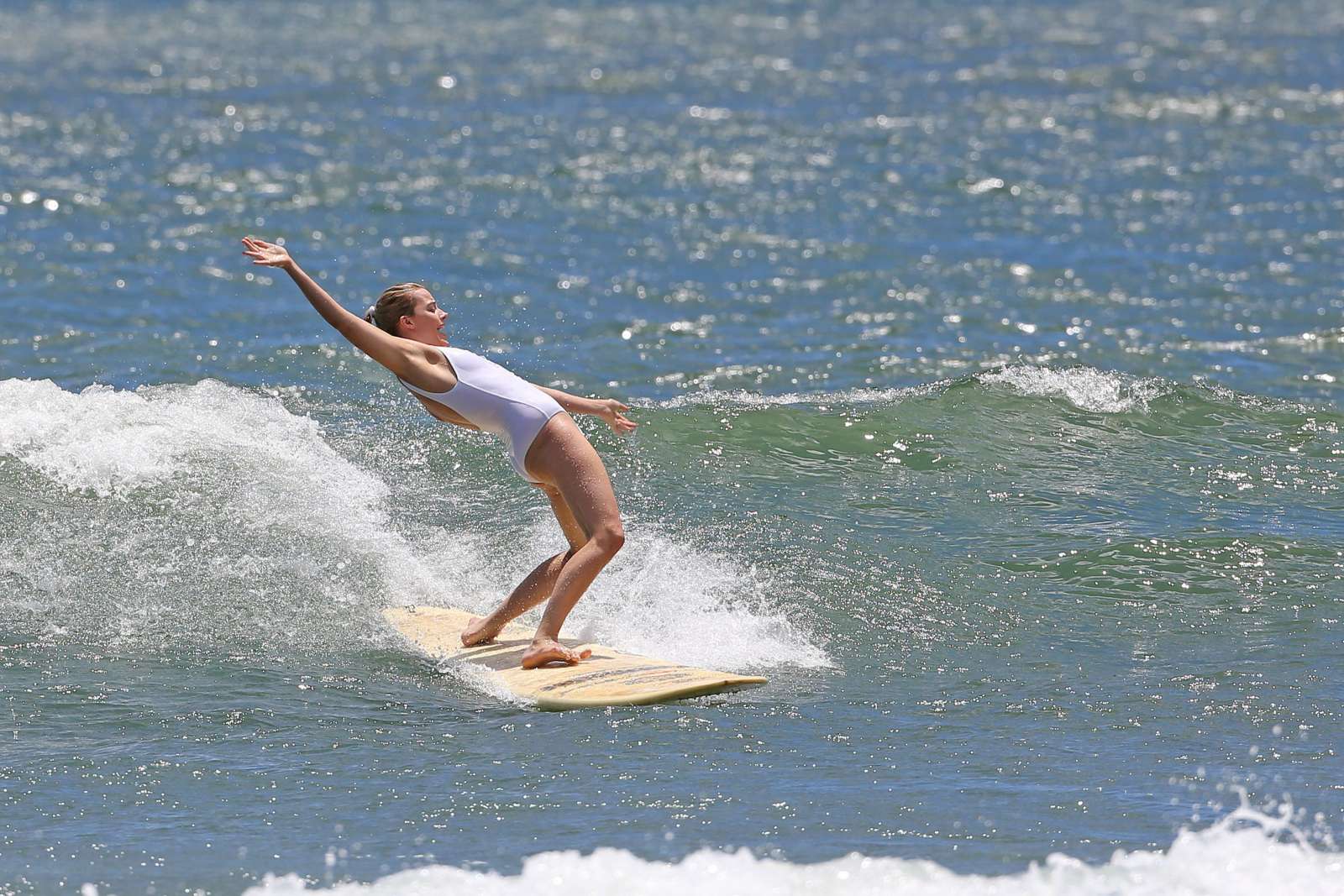 Margot Robbie in White Swimsuit in Hawaii. 