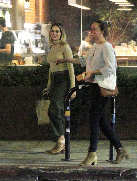 Margot Robbie - Leaving a restaurant with her friend in Los Angeles