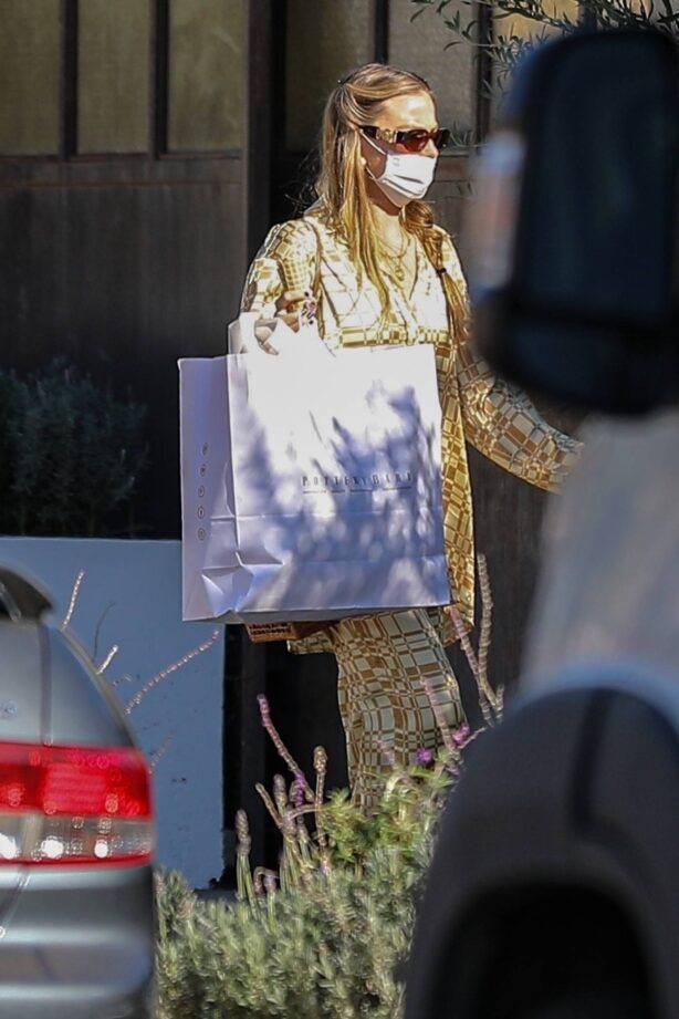 Margot Robbie - Wears golden patterned pantsuit as she visits a friend in Los Angeles