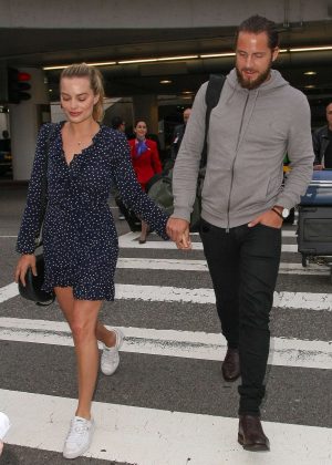 Margot Robbie With Tom Ackerley Arrives at LAX Airport in Los Angeles
